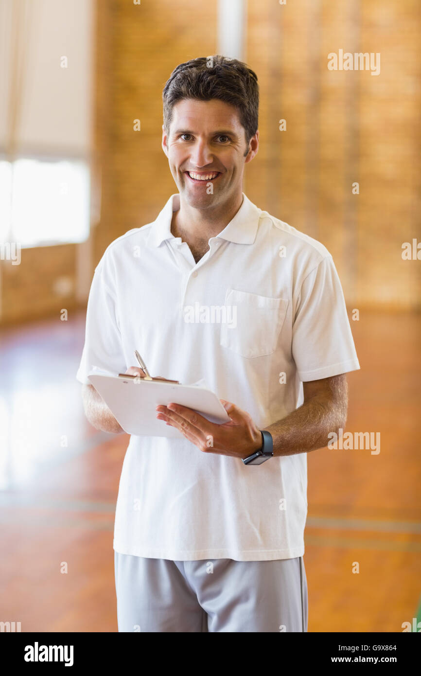 Portrait of sports teacher holding clipboard Stock Photo Alamy