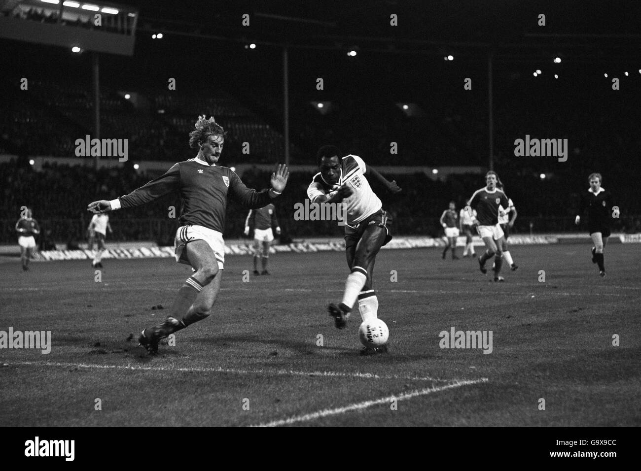 England's Luther Blissett (right) in a busy confrontation for the ball versus a Luxembourg opponent during the European Championship at Wembley Stadium Stock Photo