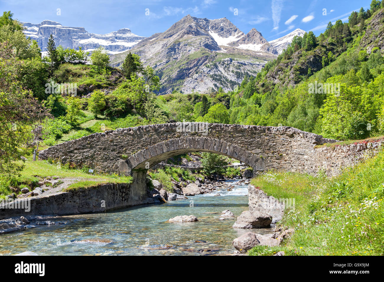 Nadau bridge over Gave de Gavarnie river in Gavarnie, Hautes-Pyrenees, France Stock Photo