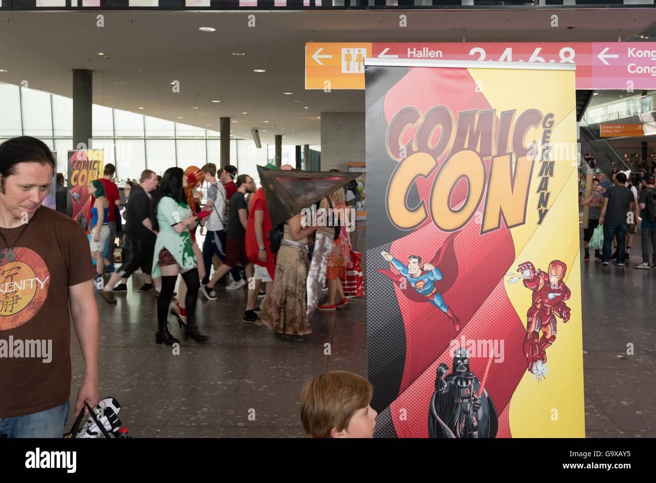 Stuttgart, Germany - June 25, 2016: Visitors, some of them dressed as cosplayers, in the entrance of the Comic Con Germany event Stock Photo