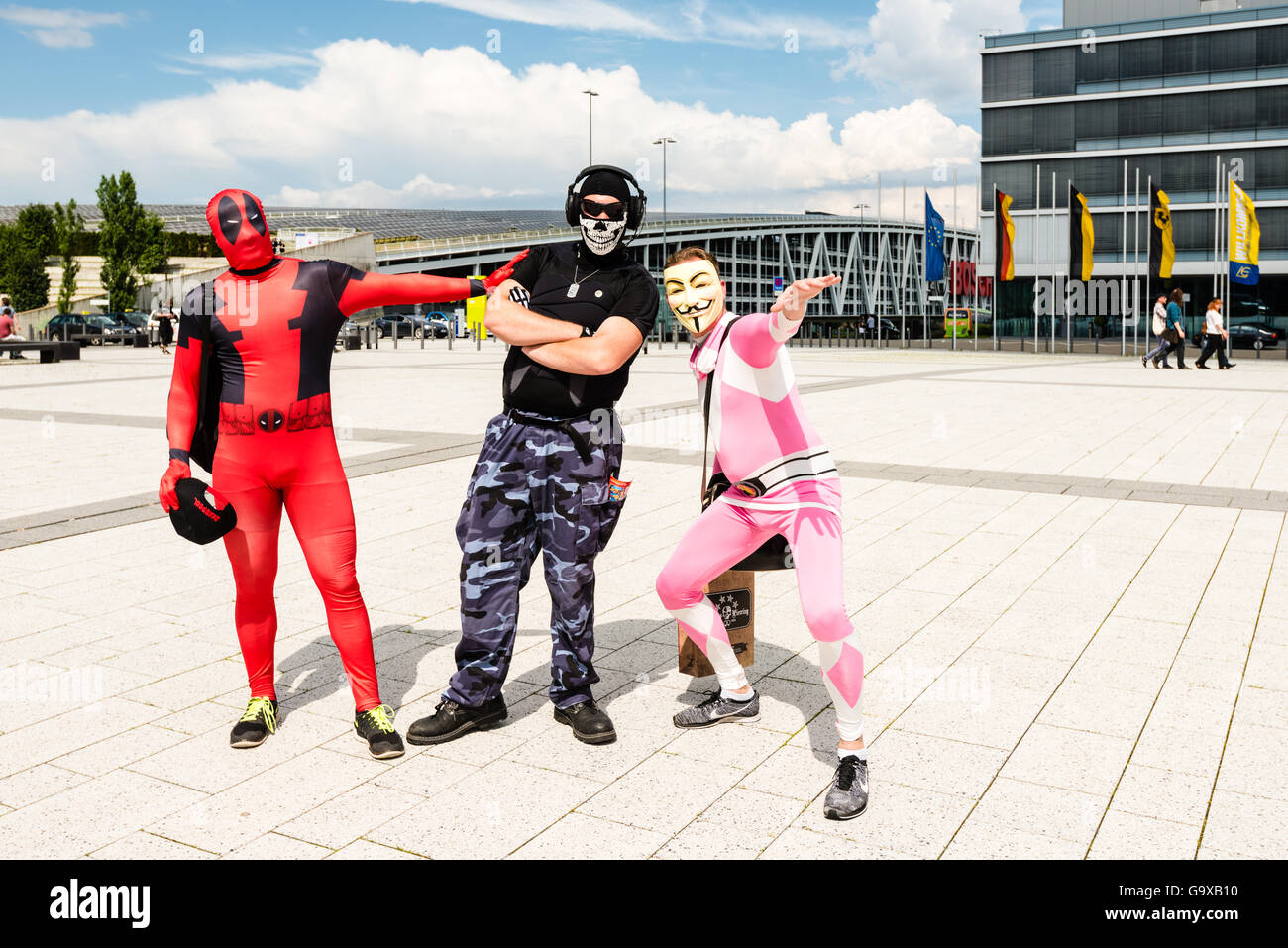 Stuttgart, Germany - June 25, 2016: Three cosplayers are posing during the Comic Con Germany event in Stuttgart in front of the Stock Photo