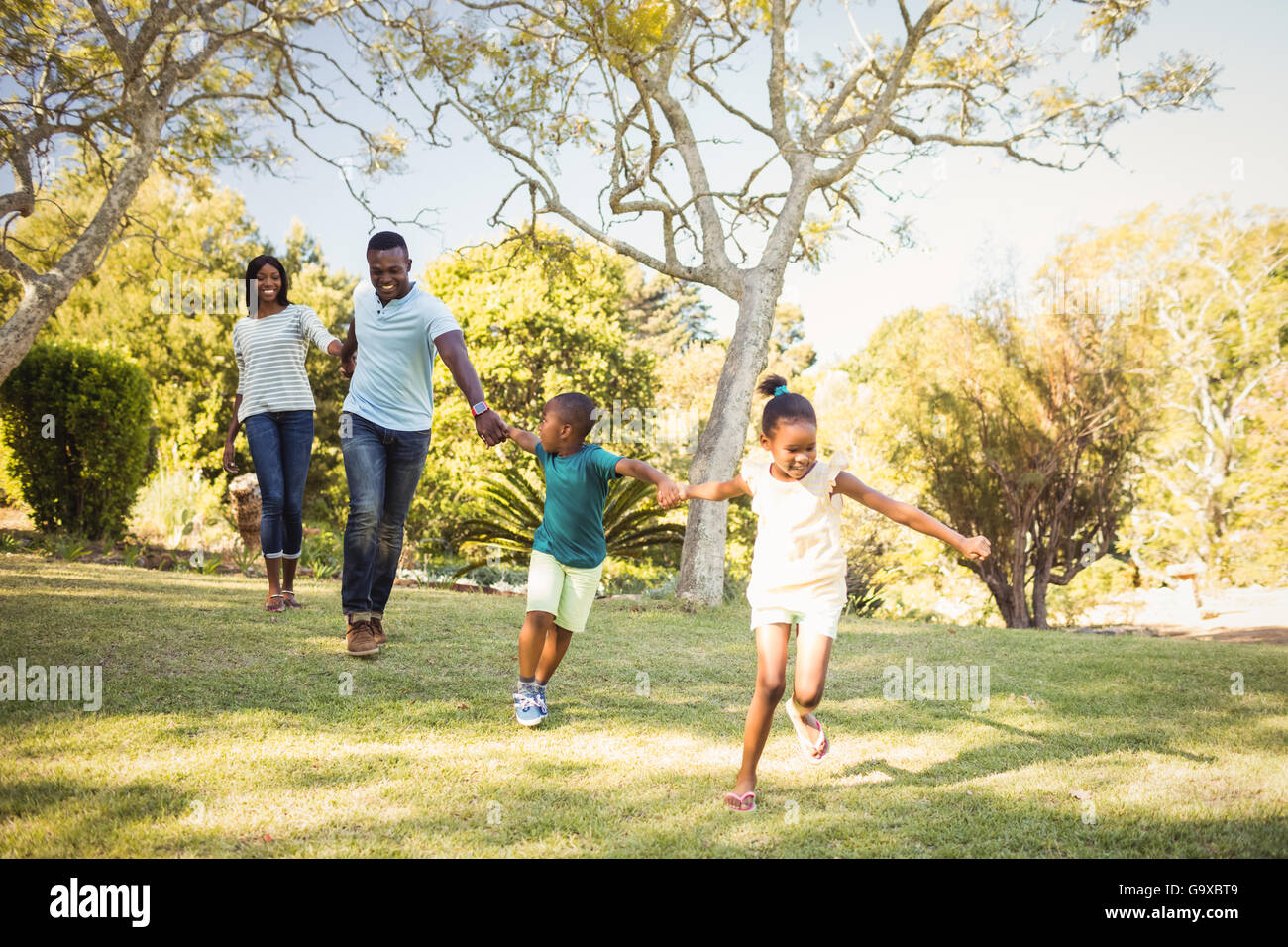 Happy family run hi-res stock photography and images - Alamy
