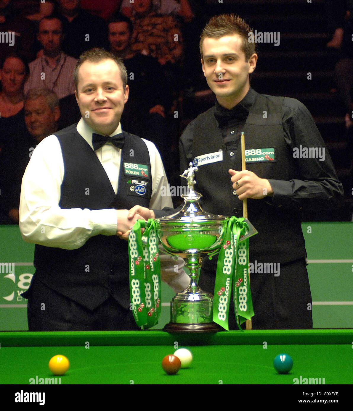 Scotlands John Higgins and Englands Mark Selby shake hands before the Final match at the World Snooker Championships at the Crucible Theatre, Sheffield Stock Photo