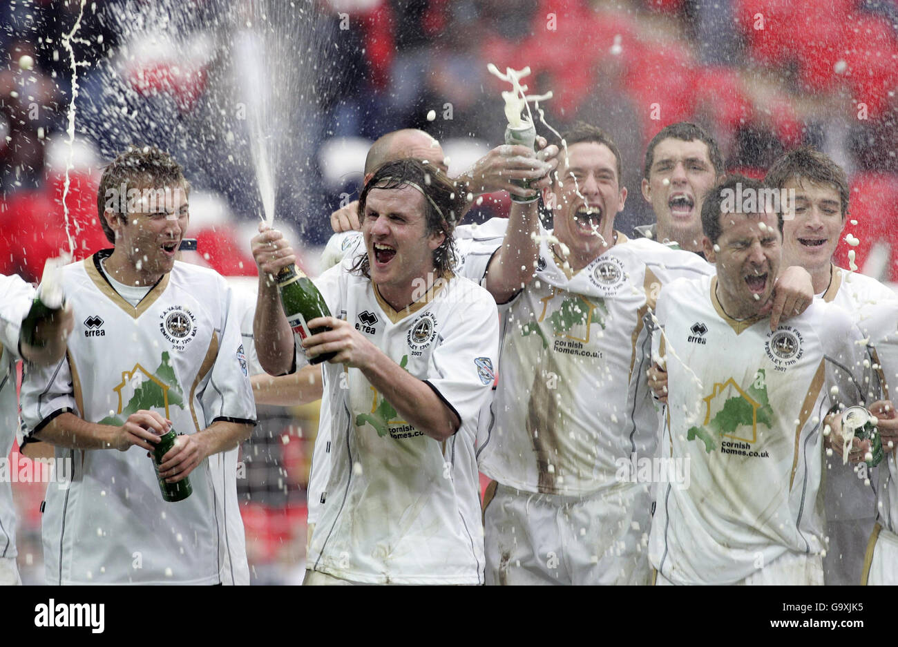 Truro's Stewart Yetton sprays champagne after winning the FA Vase