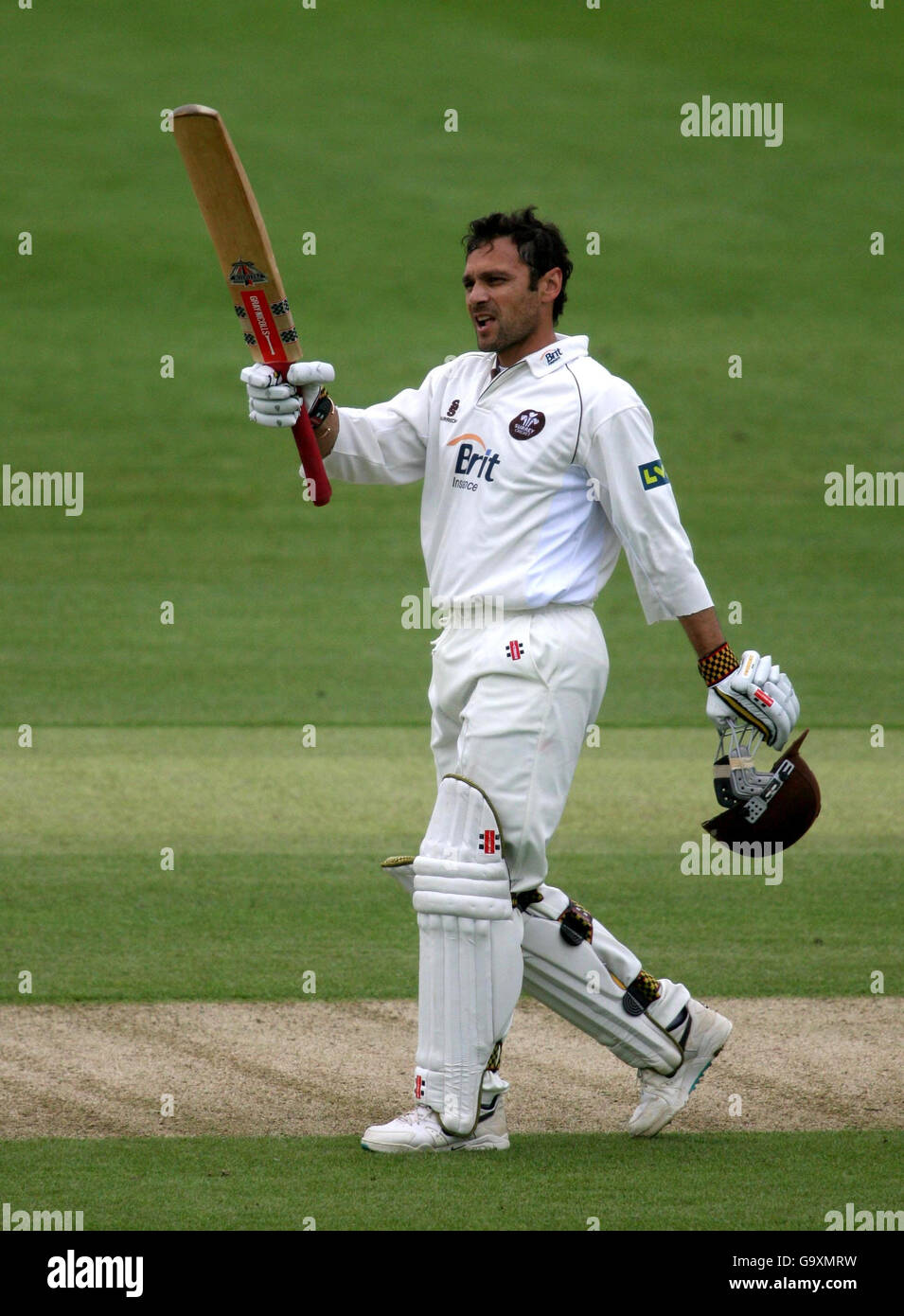 Surrey's Mark Ramprakash celebrates his century during the Liverpool Victoria County Championship Division One match at at the County Cricket Ground, Hove. Stock Photo