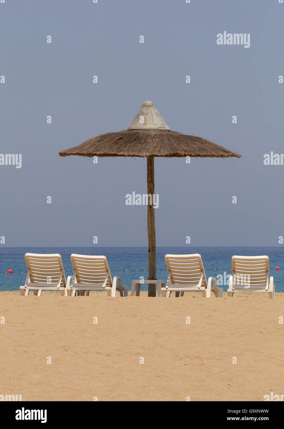 sunshade tent and chairs on beach in Fujairah, UAE Stock Photo