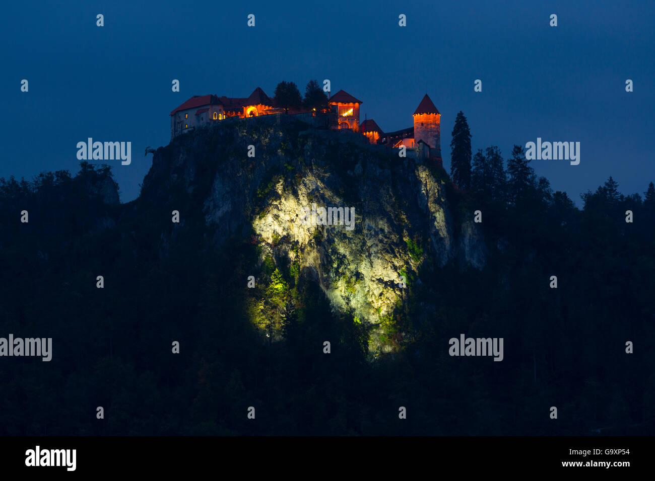 Bled Castle on cliff top at night, lit up , Bled, Slovenia, October 2014. Stock Photo