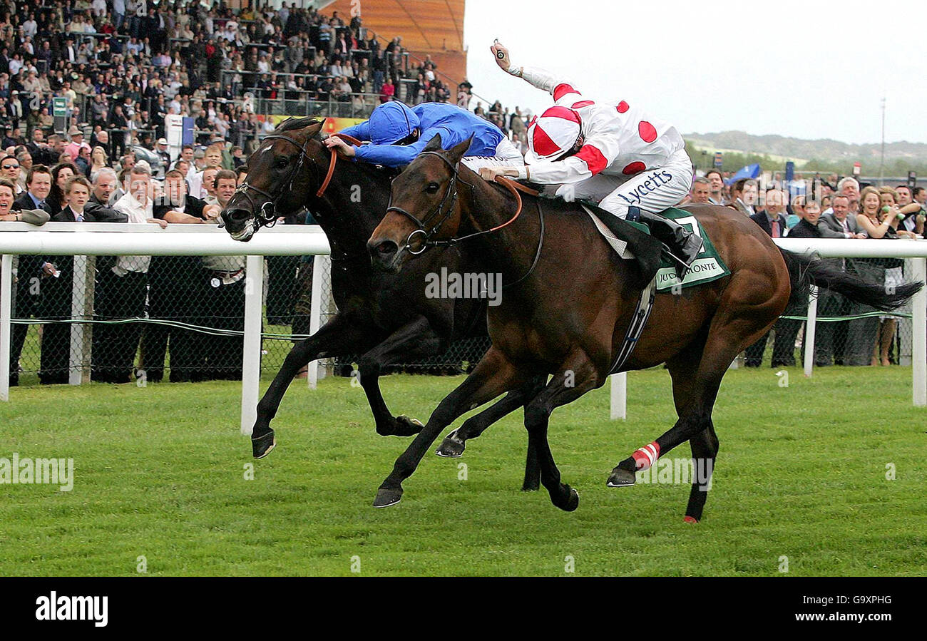 Jamie Spencer riding Red Evie, right, battles for the lead to win the Juddmonte Lockinge Stakes (Group 1) at Newbury Racecourse. Stock Photo
