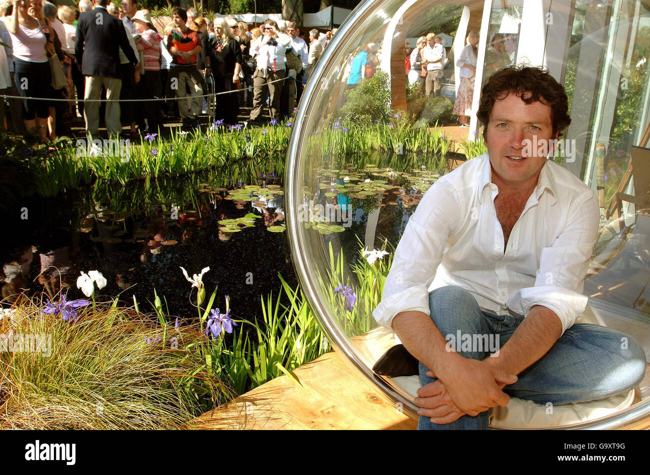 TV presenter and gardener Diarmuid Gavin relaxes in his Silver Gilt Medal winning garden at Chelsea Flower Show, in the grounds of the Royal Chelsea Hospital, west London. Stock Photo