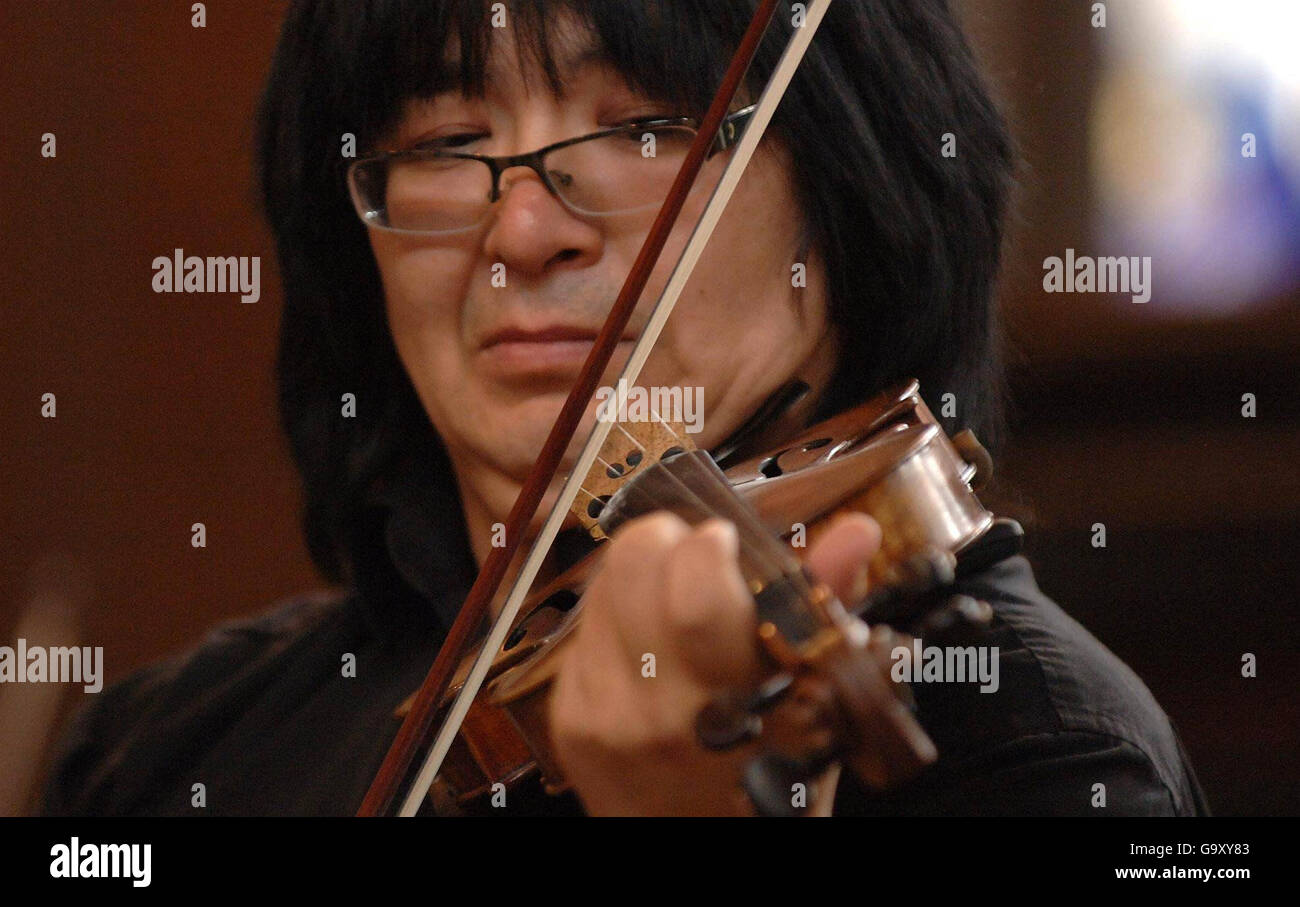 Marat Bisengaliev performs with the Turan Alem Kazakhstan Philharmonic  Orchestra as they practice composer Erran Baron Cohen's new piece at St  James's church in Piccadilly, central London Stock Photo - Alamy