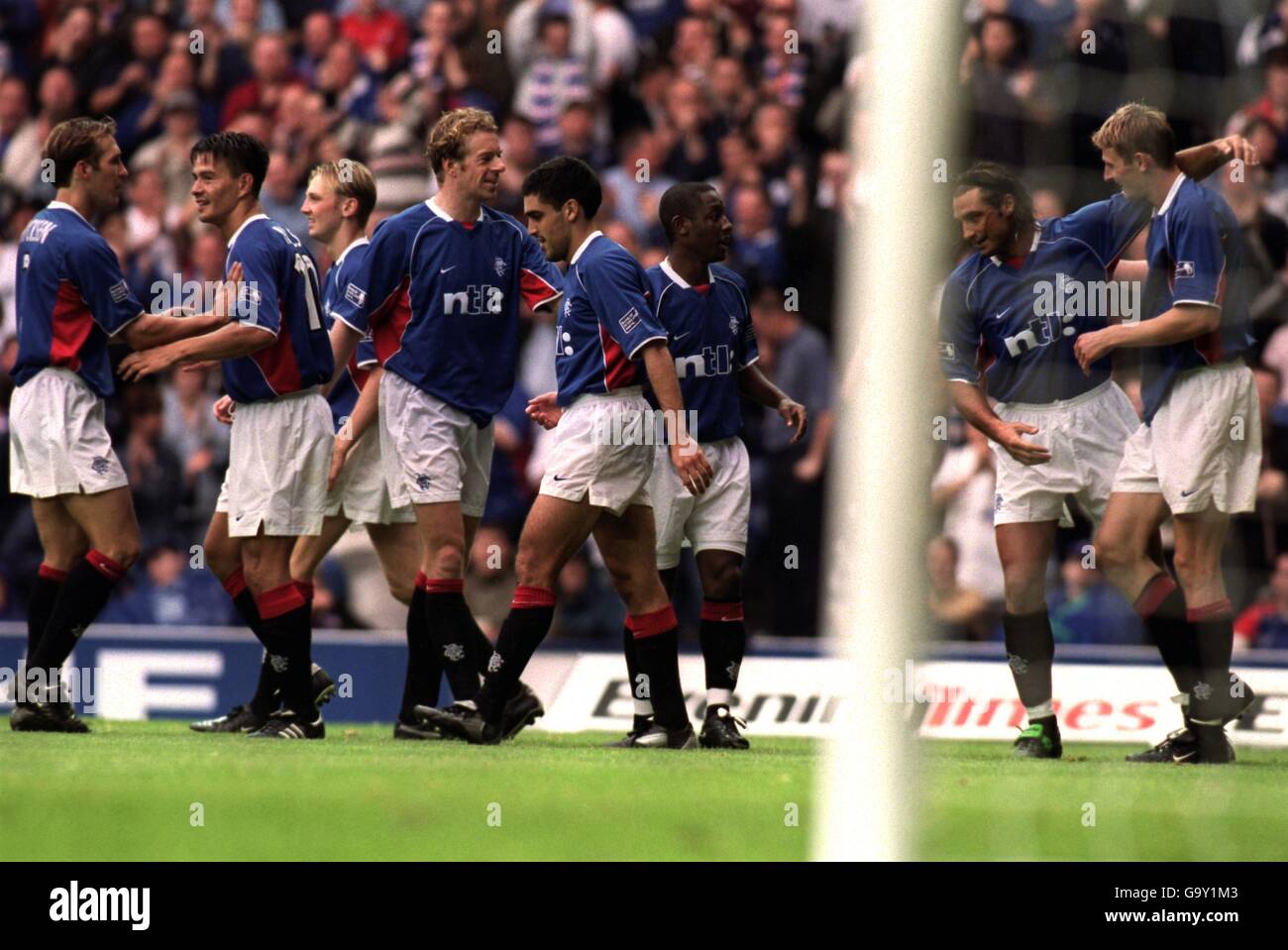 Rangers' Tore Andre Flo (r) is congratulated by his teammates after scoring their second goal of the game Stock Photo