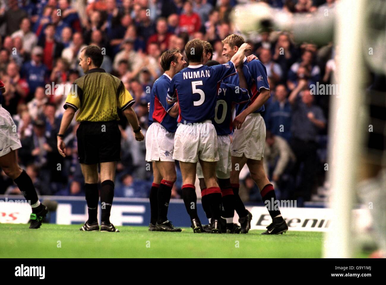 Rangers' Tore Andre Flo (r) is congratulated by his teammates after scoring their second goal of the game Stock Photo