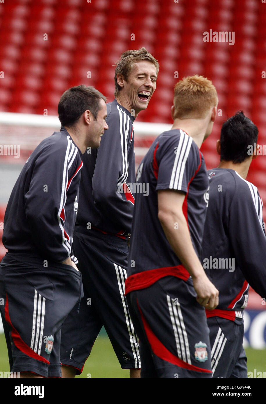 Liverpool's Peter Crouch (centre) laughs with Jamie Carragher (left) and John Arne Riise during a training session at Anfield, Liverpool. Stock Photo