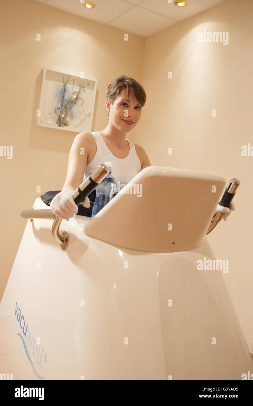 Young woman on a Vacu Well treadmill for weight loss Stock Photo