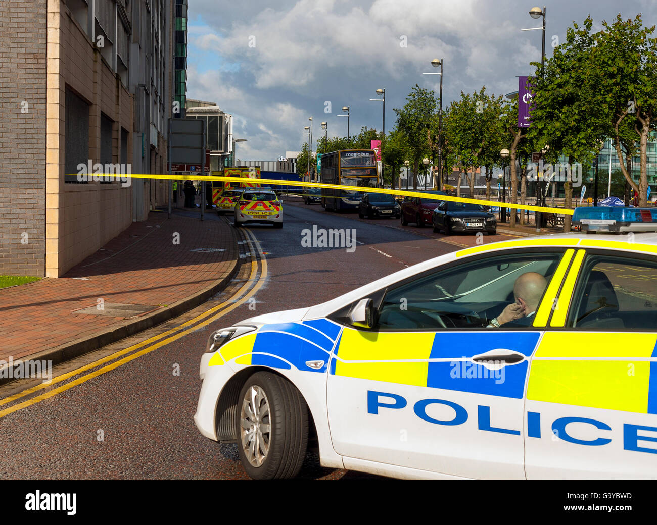 Salford Quays, Manchester. 1st July 2016. Police close two roundabouts and a stretch of road after a man plunged from the Lowry mall multi storey car park. Credit:  Stu/Alamy Live News Stock Photo