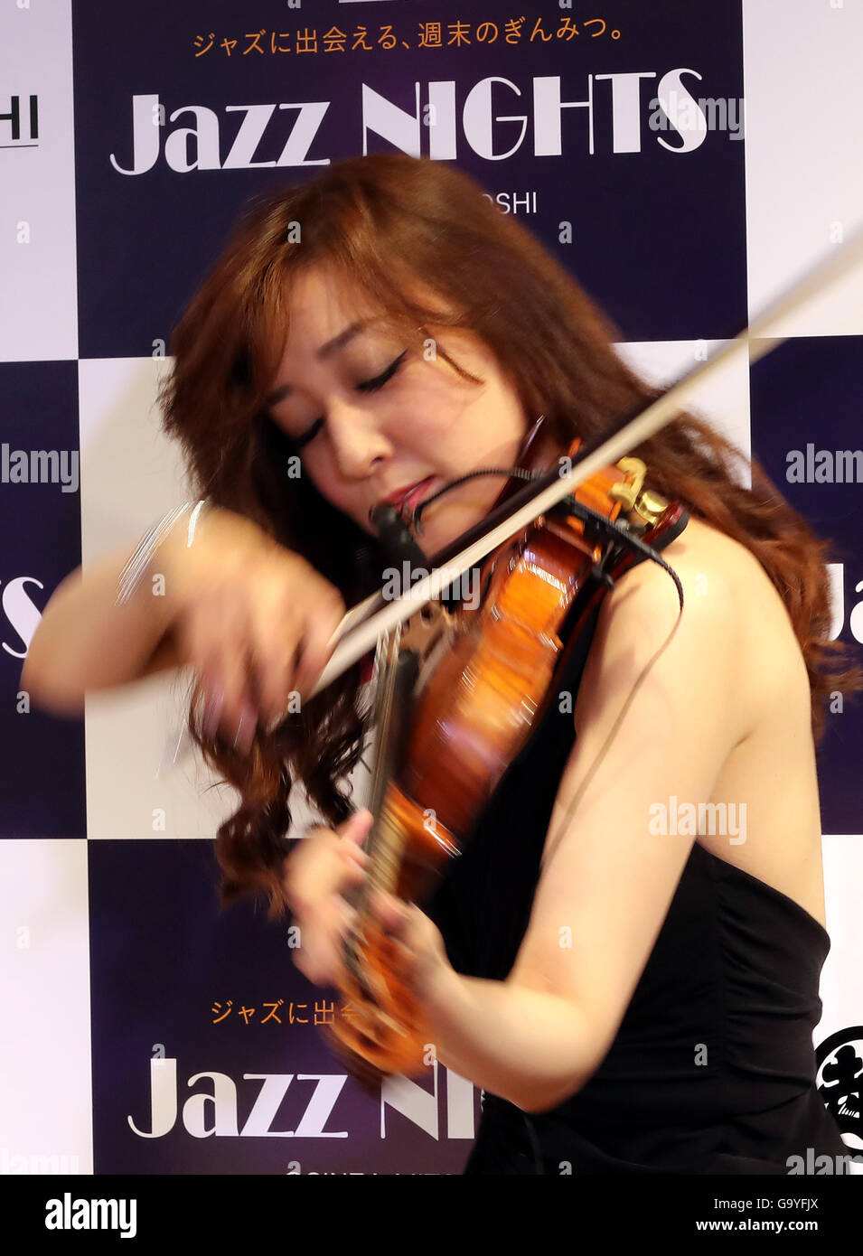 Tokyo, Japan. 1st July, 2016. Japanese violinist Junko Makiyama plays violin for a jazz session