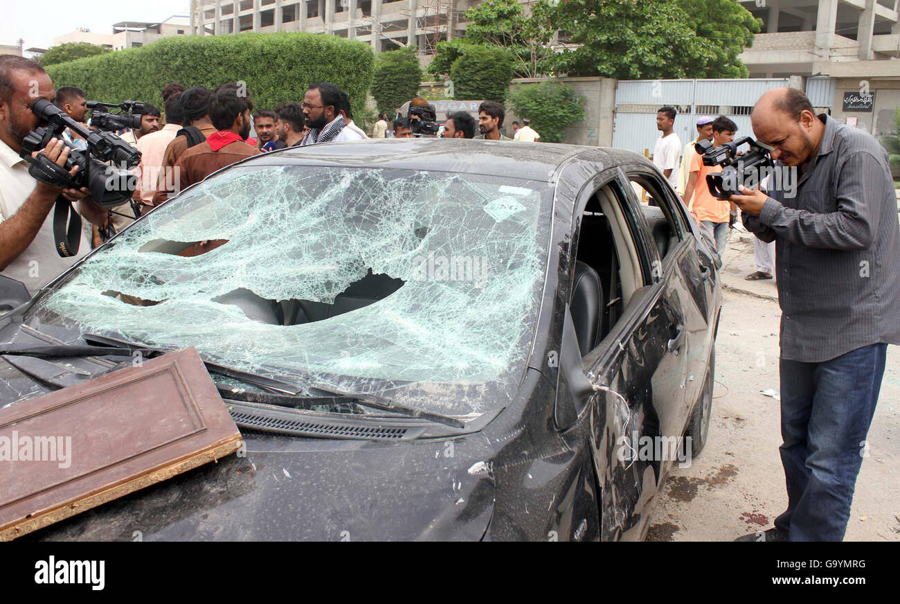 Laborers of denim mills smashed cars during demonstration against nonpayment of bonus and salaries on time before arrival of Eid-ul-Fitar, at Vita Chowrangi in Korangi area of Karachi July 04, 2016. Stock Photo