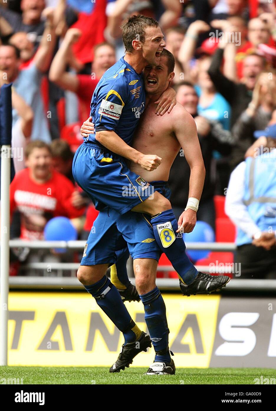 Soccer - Nationwide Conference - Play Off Final - Exeter City v Morecambe - Wembley Stadium. Morecambe's Danny Carlton (right) celebrates after scoring the third goal of the game, with team mate Gary Hunter. Stock Photo