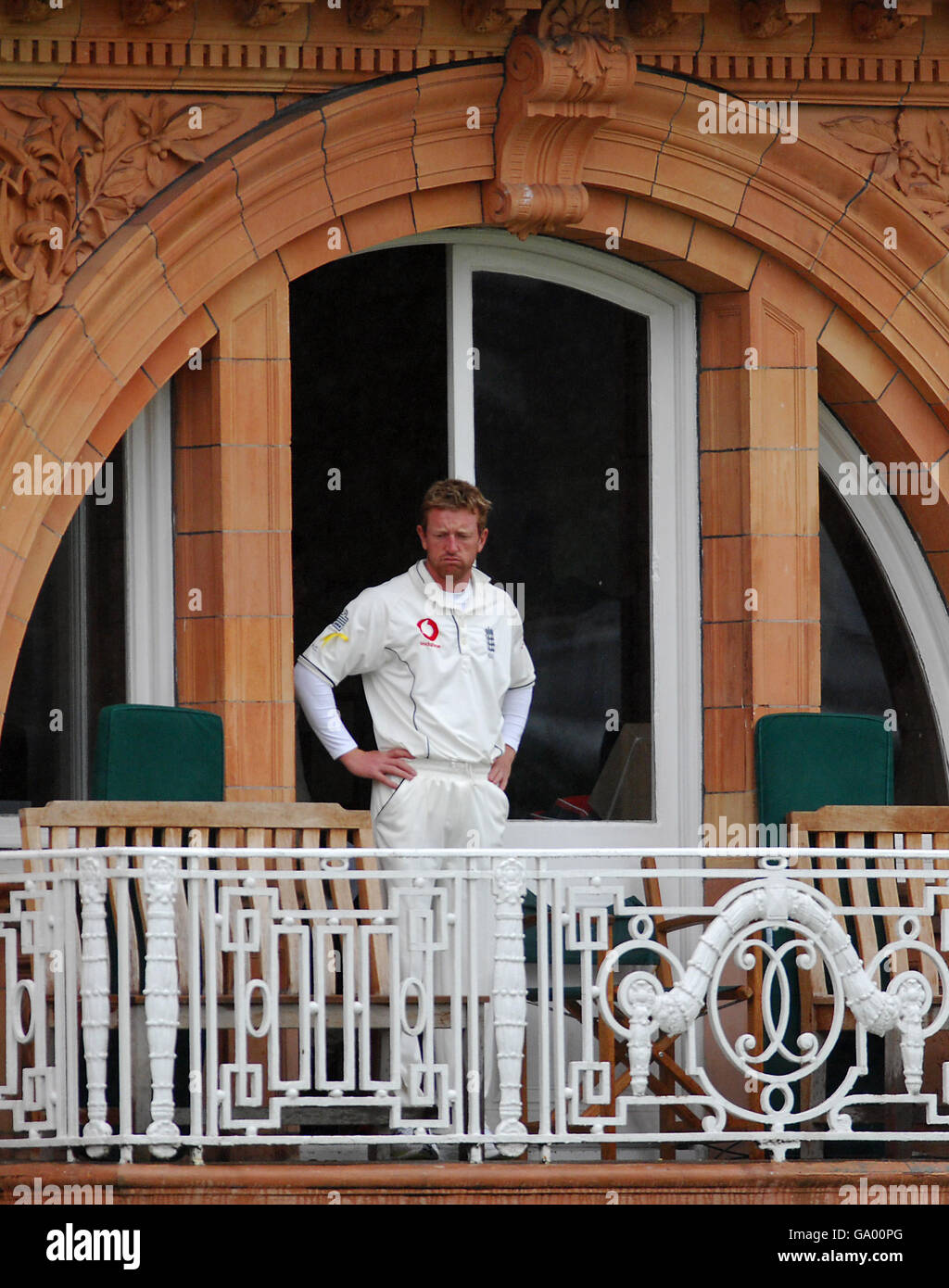 Paul Collingwood looks out as rain stops play at Lords during day five of the test between England and the West Indies Stock Photo