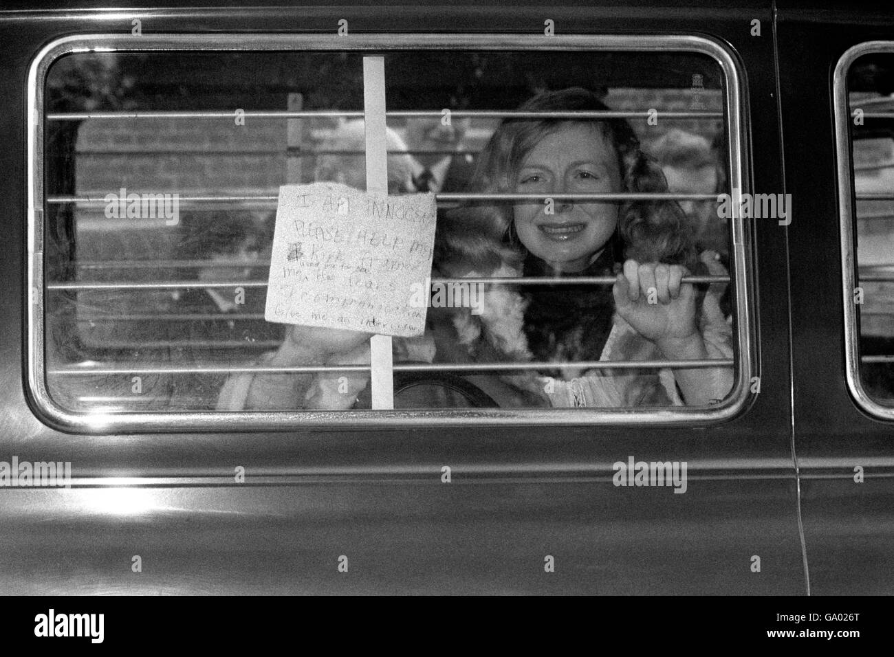 Miss Joyce McKinney protest her innocence in the back of a police van