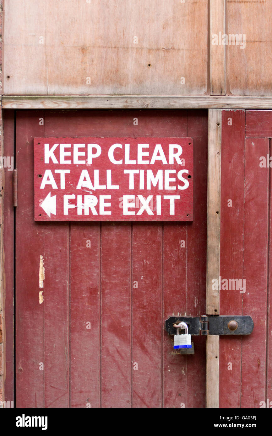 Locked wooden Fire Exit, danger locked, old building, burn, heat, metal