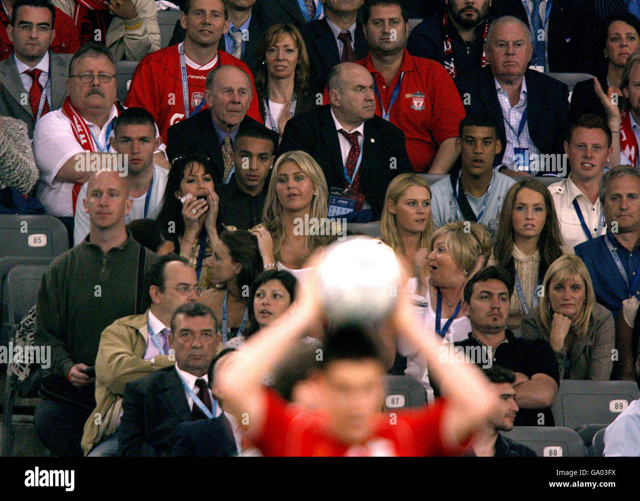Liverpool stock. Liverpool players' wives and girlfriends look on from ...