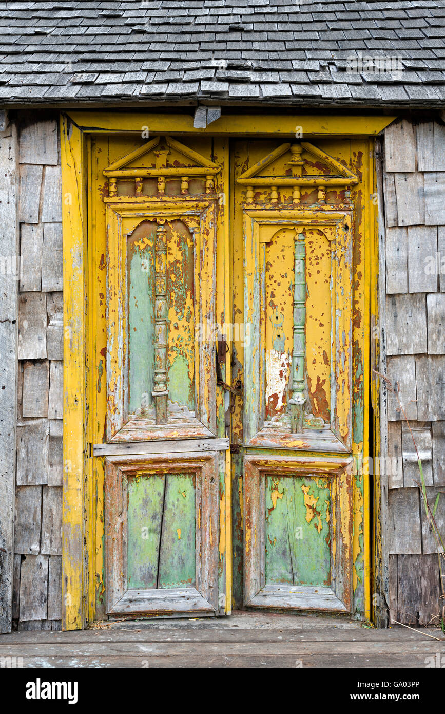 Old damaged door in Castro, Chiloe Island, Chile Stock Photo