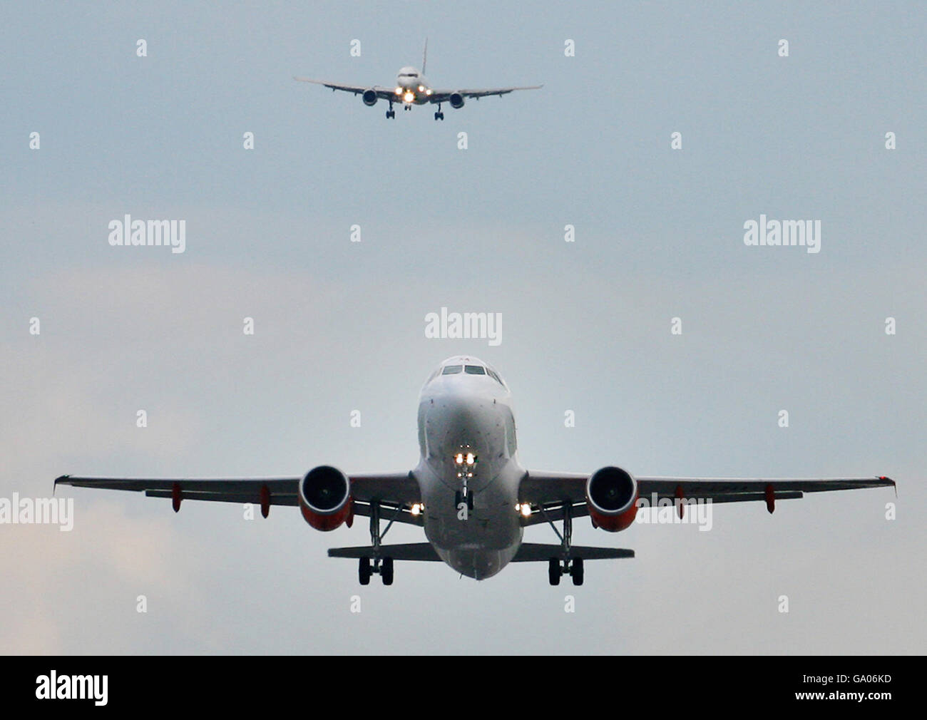 Passenger planes queue-up to land at Gatwick Airport in Sussex. Stock Photo