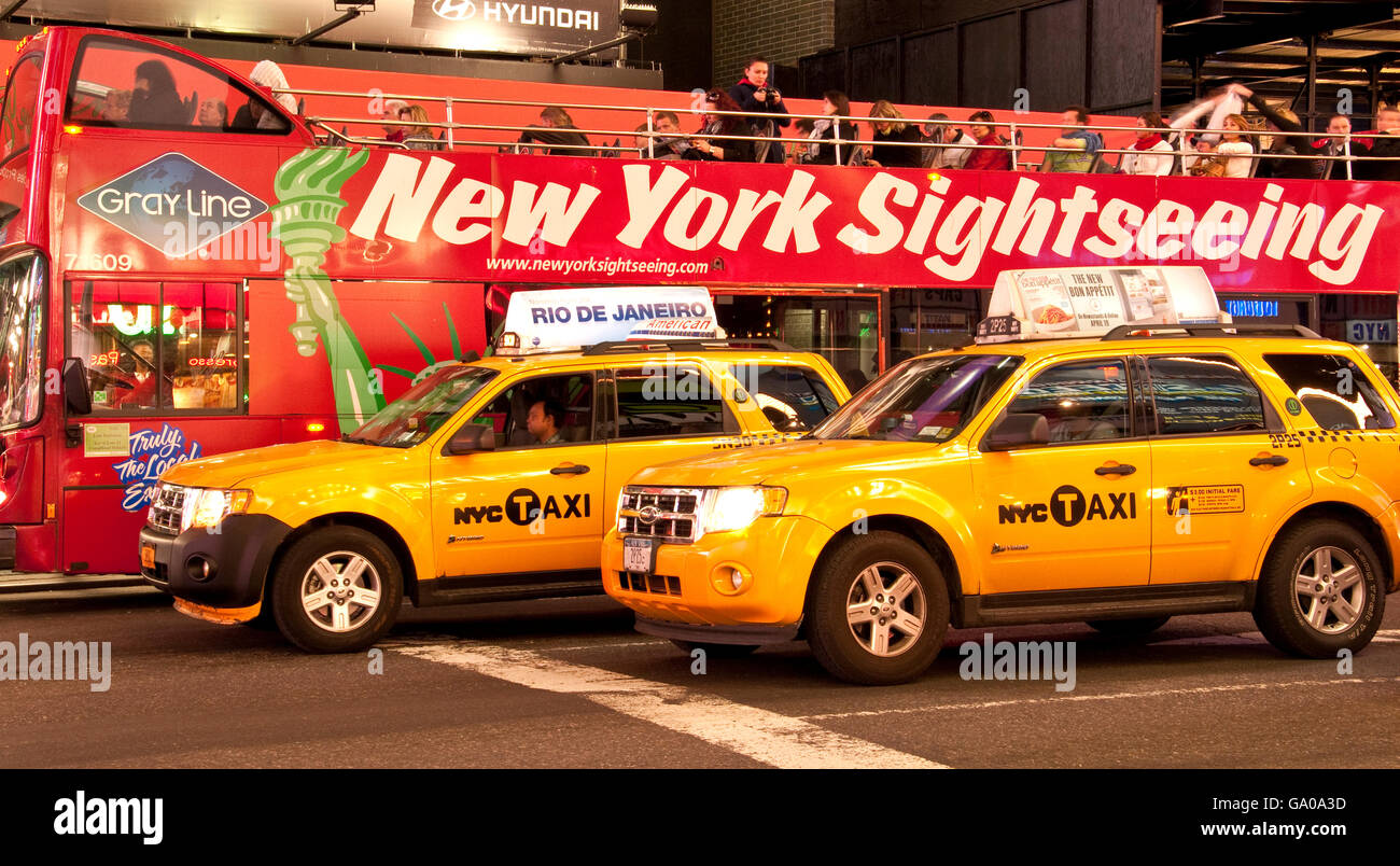 New York sightseeing bus and yellow cabs, Times Square, 42nd Street, New York City, New York, USA Stock Photo