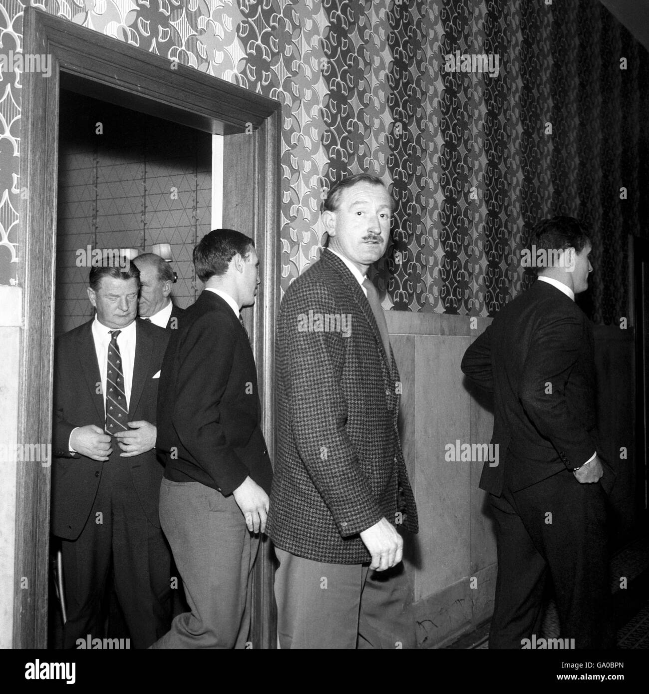 After his seven day suspension, Manchester United's Pat Crerand turns away from the camera as he leaves his personal hearing before the F.A Disciplinary Committee in Manchester Stock Photo