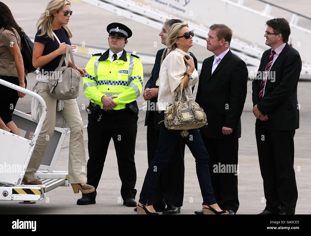 Alex Curran (right) Fiance of Liverpool's Steven Gerrard and Abigail Clancy Girlfriend of Liverpool's Peter Crouch arrives at Liverpool John Lennon Airpor Stock Photo
