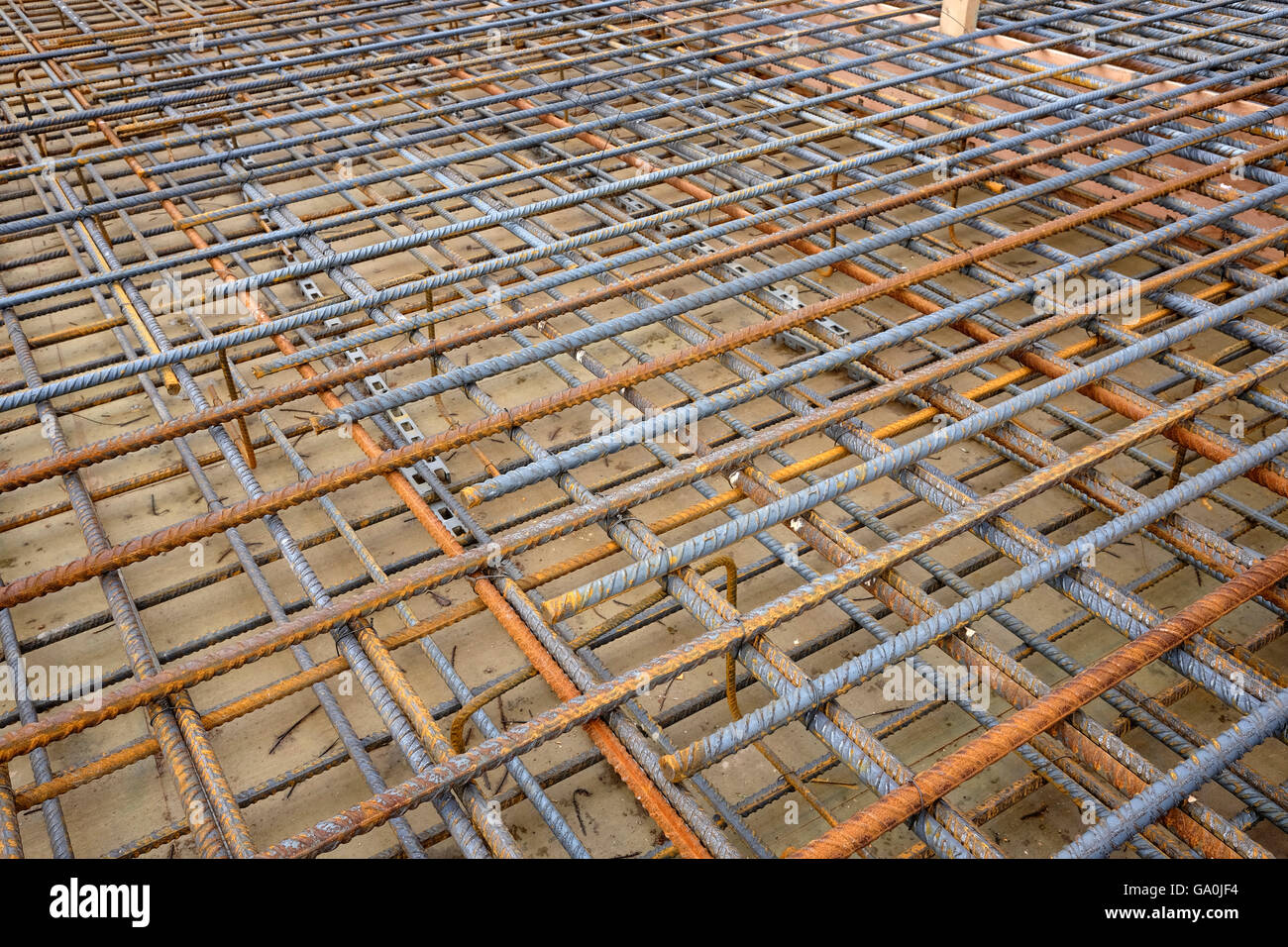 Construction steel reinforcing rods in a mesh before the concrete is