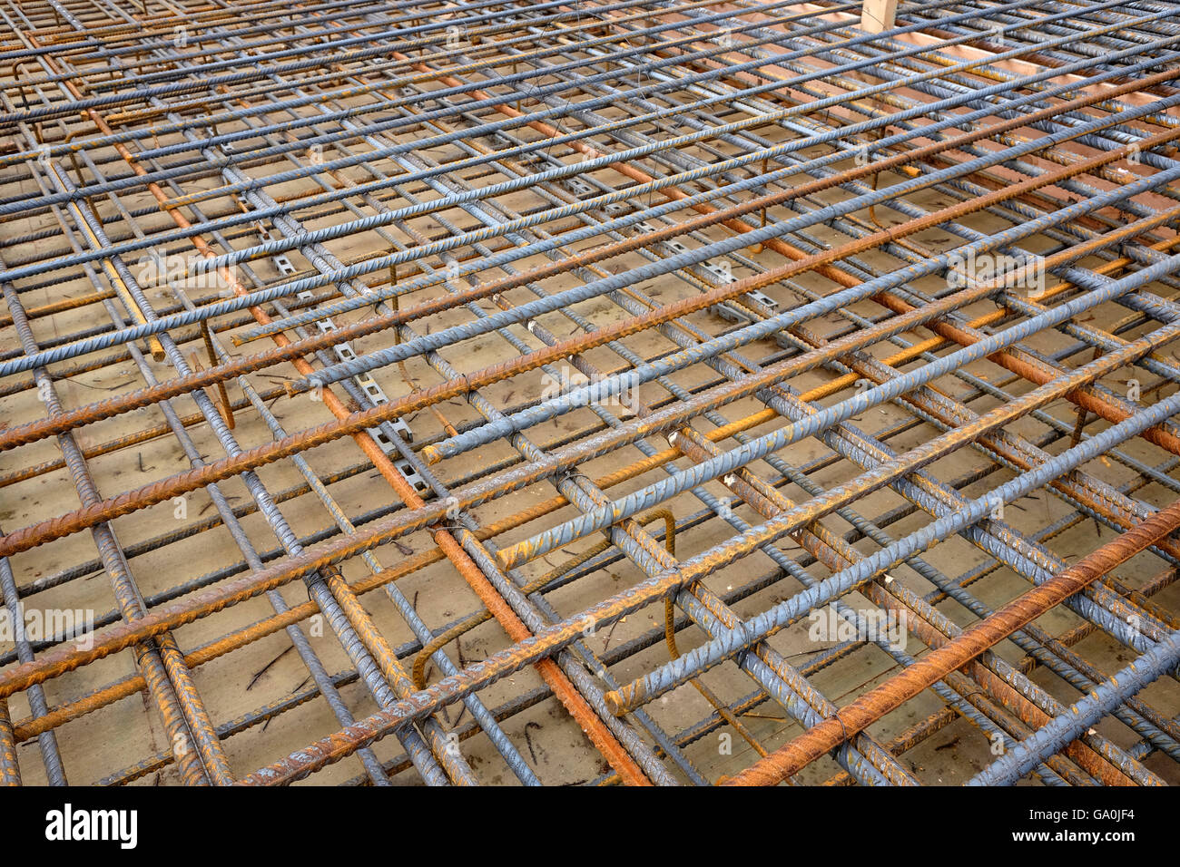 Construction steel reinforcing rods in a mesh before the concrete is ...