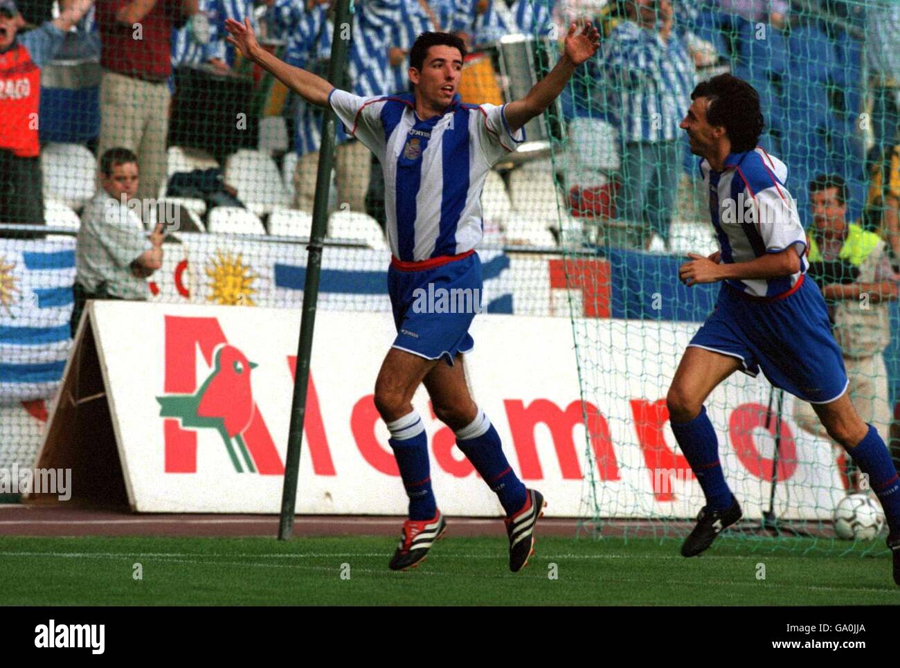 Soccer - 56th Teresa Herrera Trophy - Semi Final - Deportivo La Coruna v Penerol. Deportivo La Coruna's Roy Makaay (l) turns away in delight after scoring as his teammate Jose Amavisca (r) runs to congratulate him Stock Photo