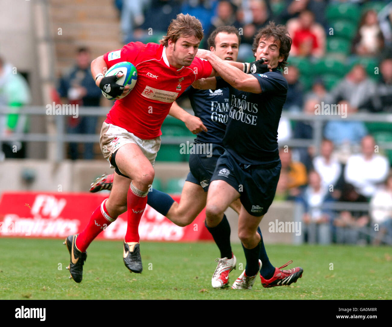 Rugby Union - Emirates Airline London Sevens - Wales v Scotland - Twickenham. Wales' Tal Selley (l) hands off the tackle of Scotland's Colin Gregor (r) Stock Photo