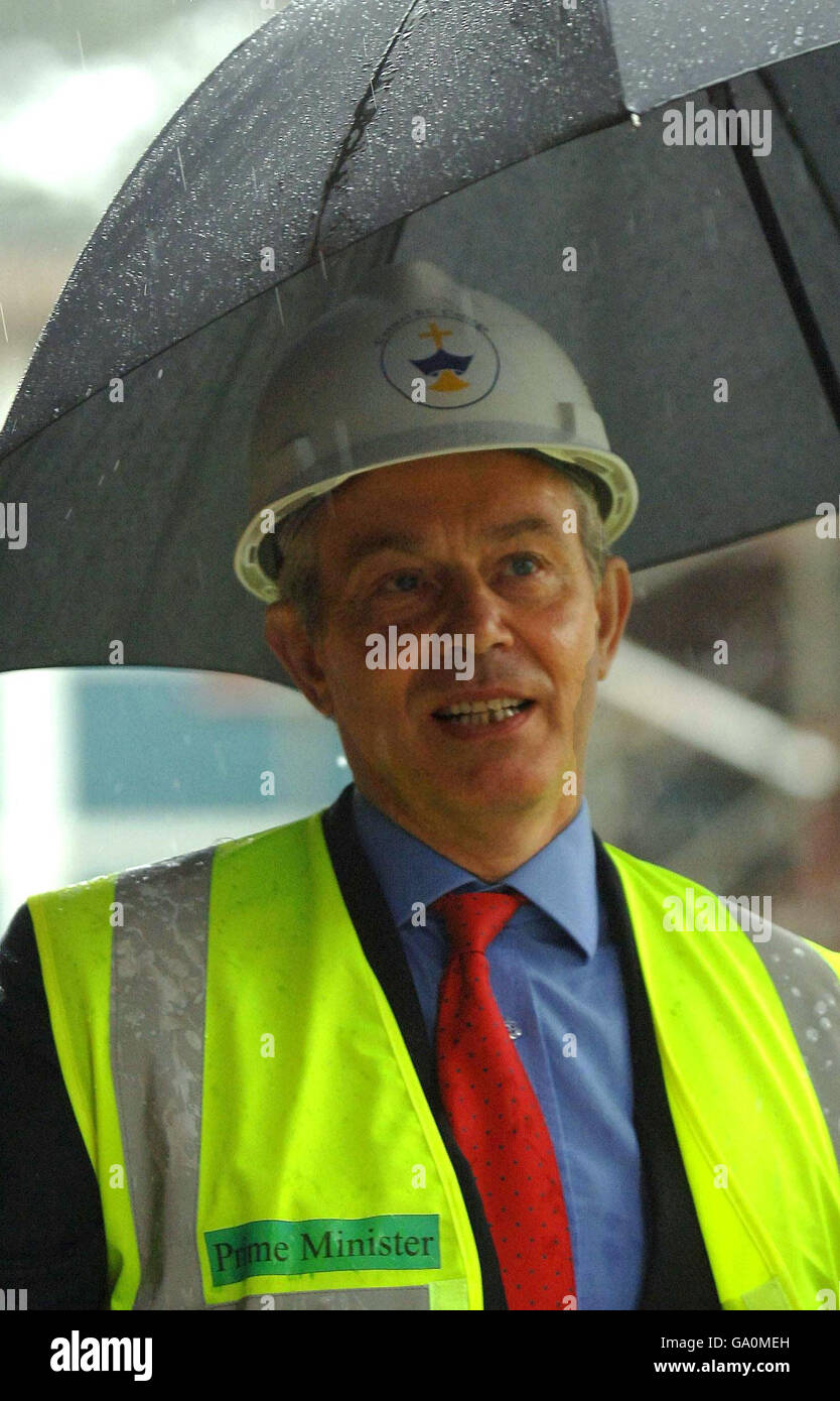 Britain's Prime Minister Tony Blair looks around new building work at Carmel RC Technology College in Darlington, during an official visit to unveil a plaque marking the opening of a new science block. Stock Photo