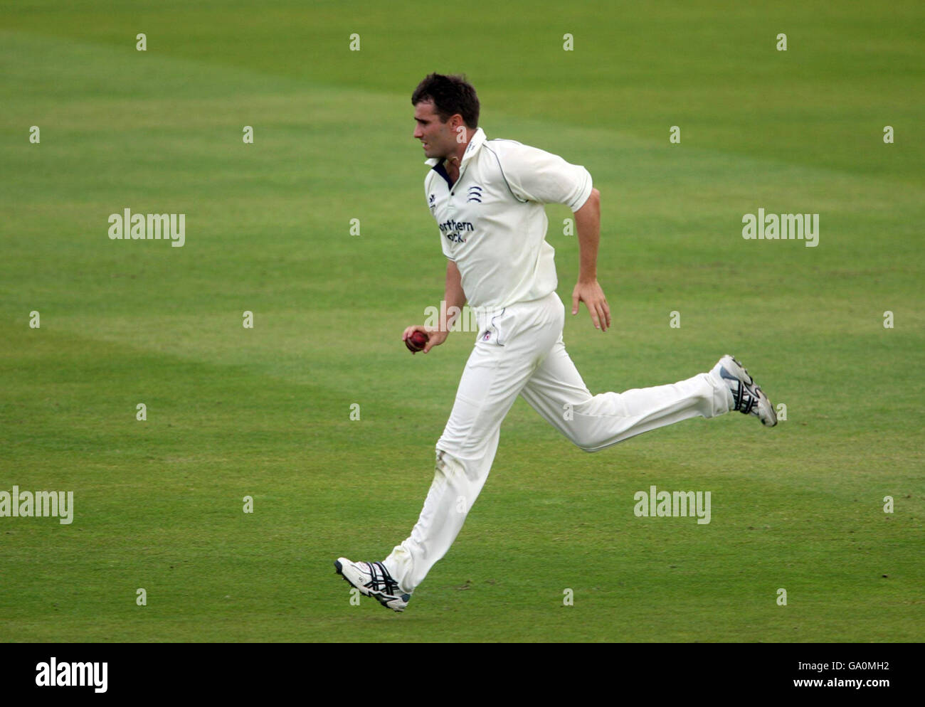 Middlesex's Tim Murtagh runs in to bowl only pull up with a muscle injury during the Liverpool Victoria County Championship Division Two match against Essex at Lord's Cricket Ground, St John's Wood, London. Stock Photo