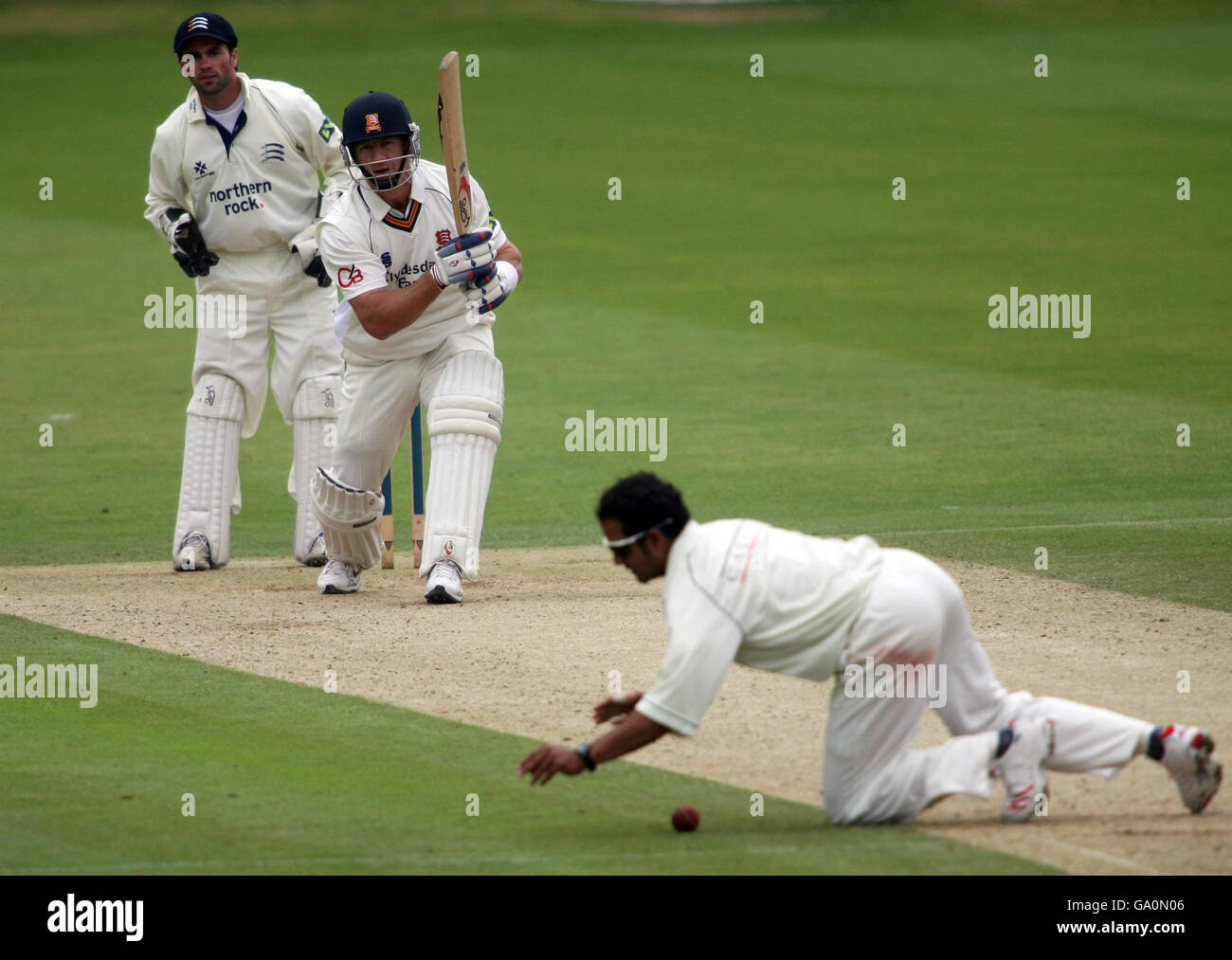Middlesex's Murali Kartik fails to stop Essex's Andy Bichel hitting four runs during the Liverpool Victoria County Championship Division Two match at Lord's Cricket Ground, St John's Wood, London. Stock Photo