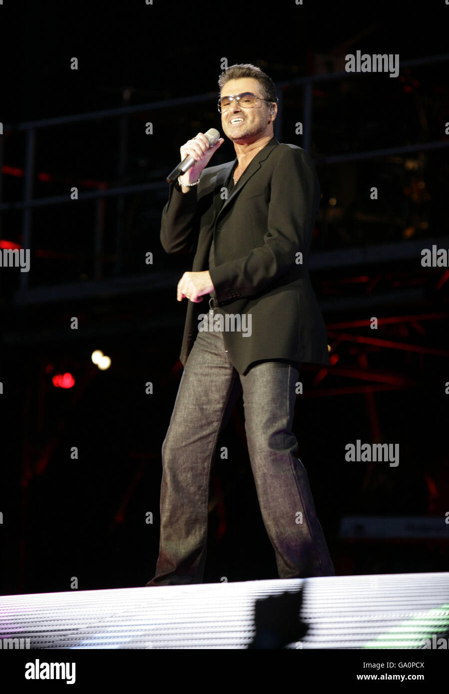 : George Michael performing in concert on the first night of his 25 ...