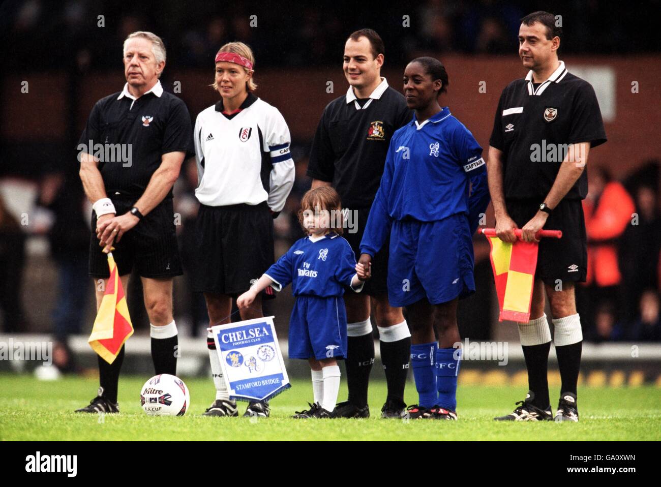 Fulham Ladies captain Marianne Pettersen (second l) and Chelsea Ladies captain Natasha Nevin (second r) pose for pictures with the officials before the match Stock Photo