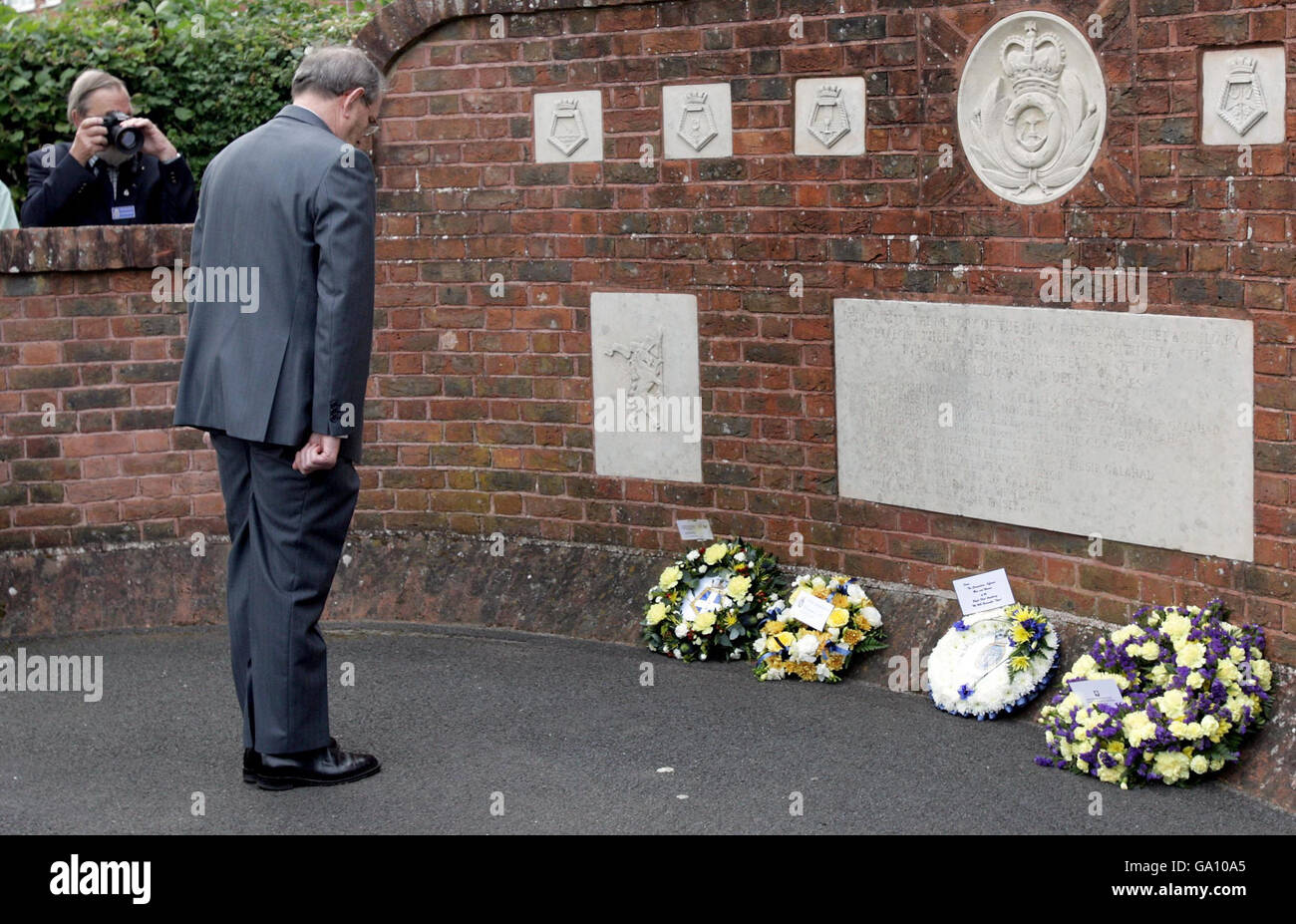 Captain Phil Roberts lays a wreath at a a Falklands Sir Galahad