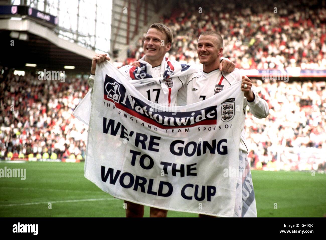 England's goal scorers Teddy Sheringham and David Beckham celebrate qualifying for the 2002 England's goal scorers Teddy Sheringham and David Beckham celebrate qualifying for the 2002