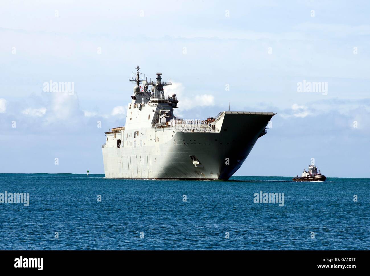 Royal Australian Navy Canberra-class landing helicopter dock ship HMAS Canberra pulls into Pearl Harbor for the annual Rim of the Pacific multi-national exercises June 28, 2016 in Honolulu, Hawaii. Twenty-six nations, more than 40 ships and submarines, will take part in the world's largest international maritime exercise. Stock Photo
