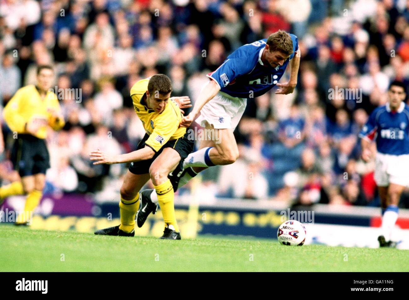 Scottish Soccer - Scottish Premiership - Rangers v Kilmarnock. Rangers' Tore Andre Flo is tripped by Kilmarnock's Chris Innes Stock Photo