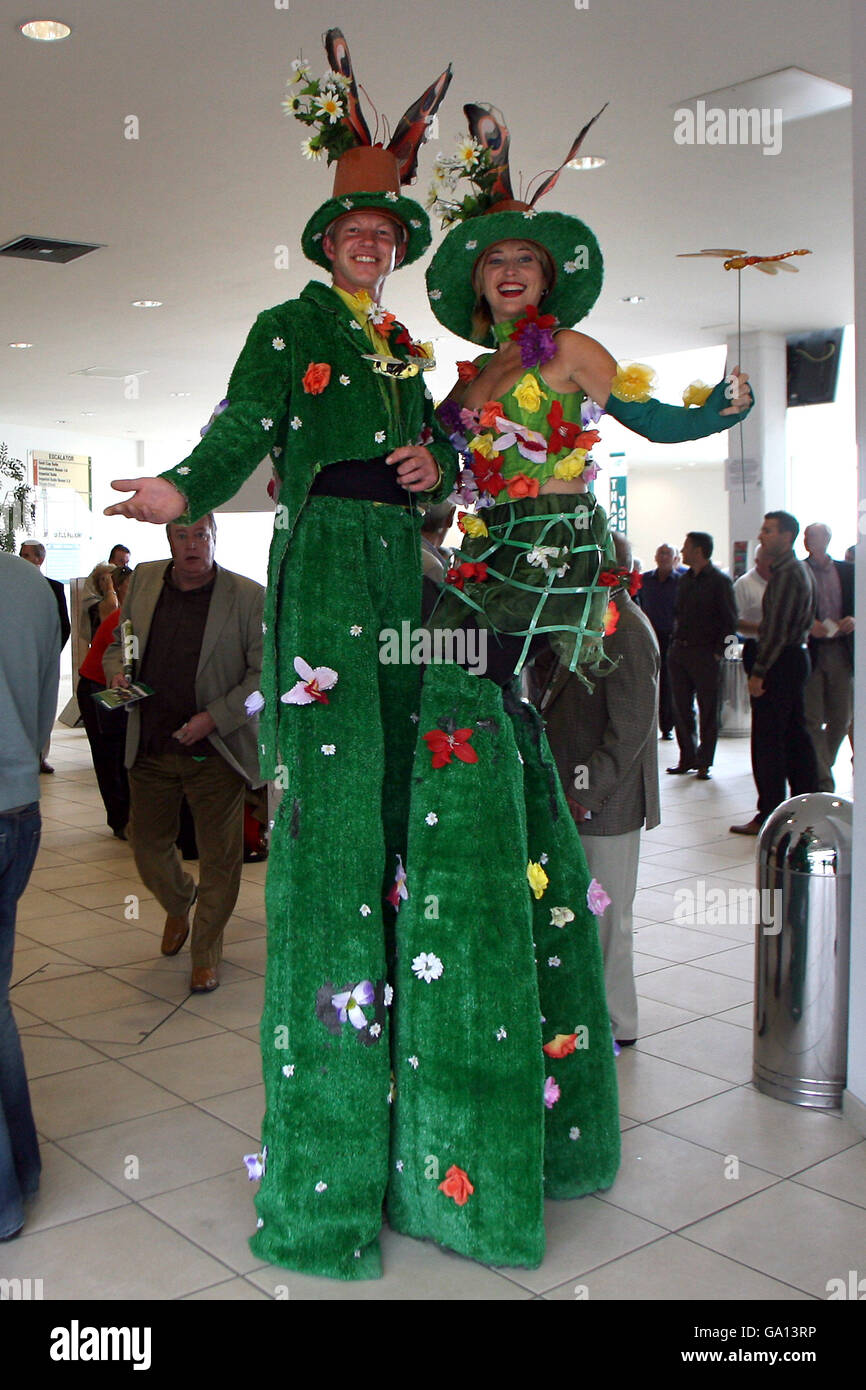 Stilt walkers entertain the crowd on Irish Weekend at Sandown Park