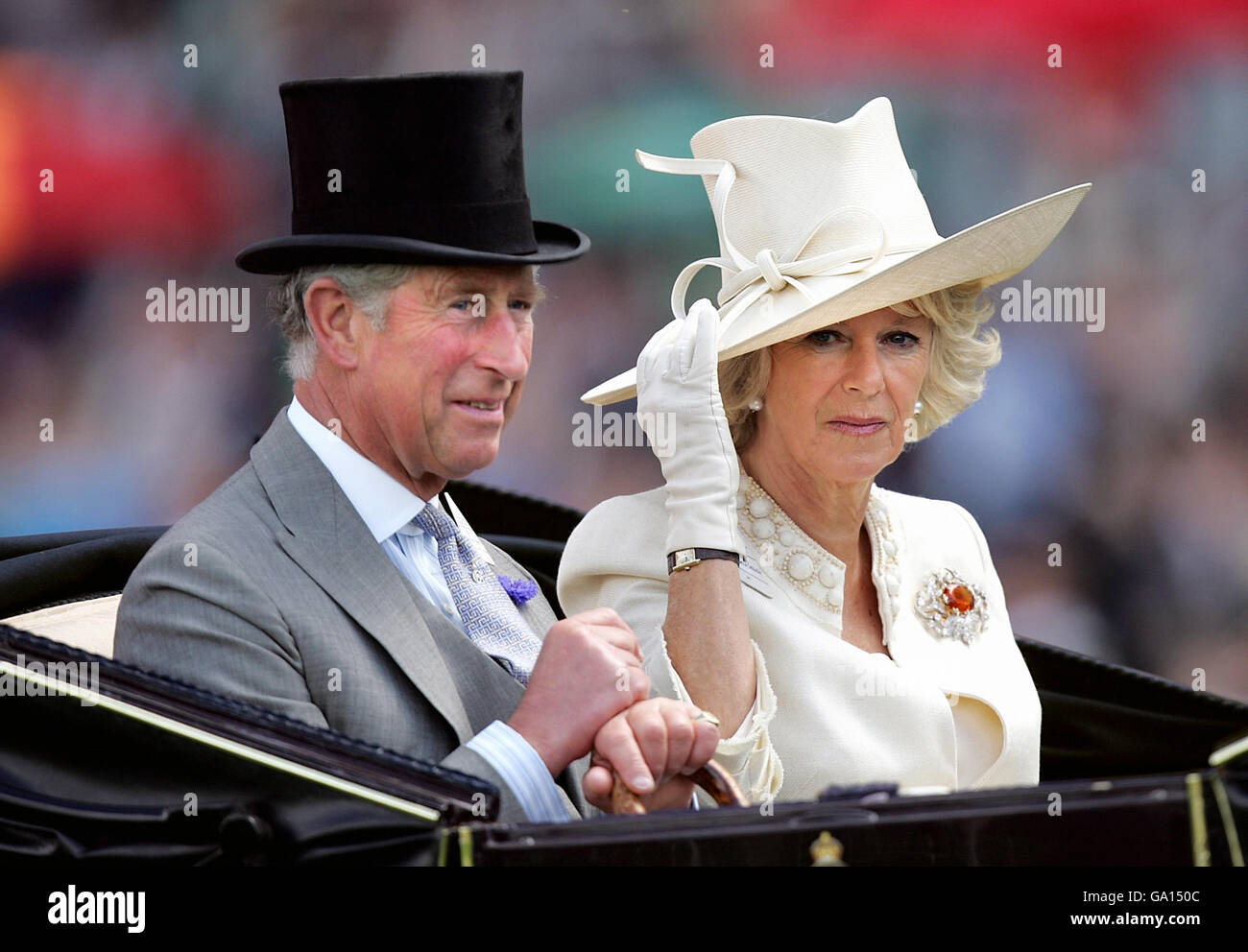 Britain's Prince of Wales and Duchess of Cornwall arrive in an open-topped carriage at the Ascot Racecourse, Berkshire, on day two of Royal Ascot. Stock Photo