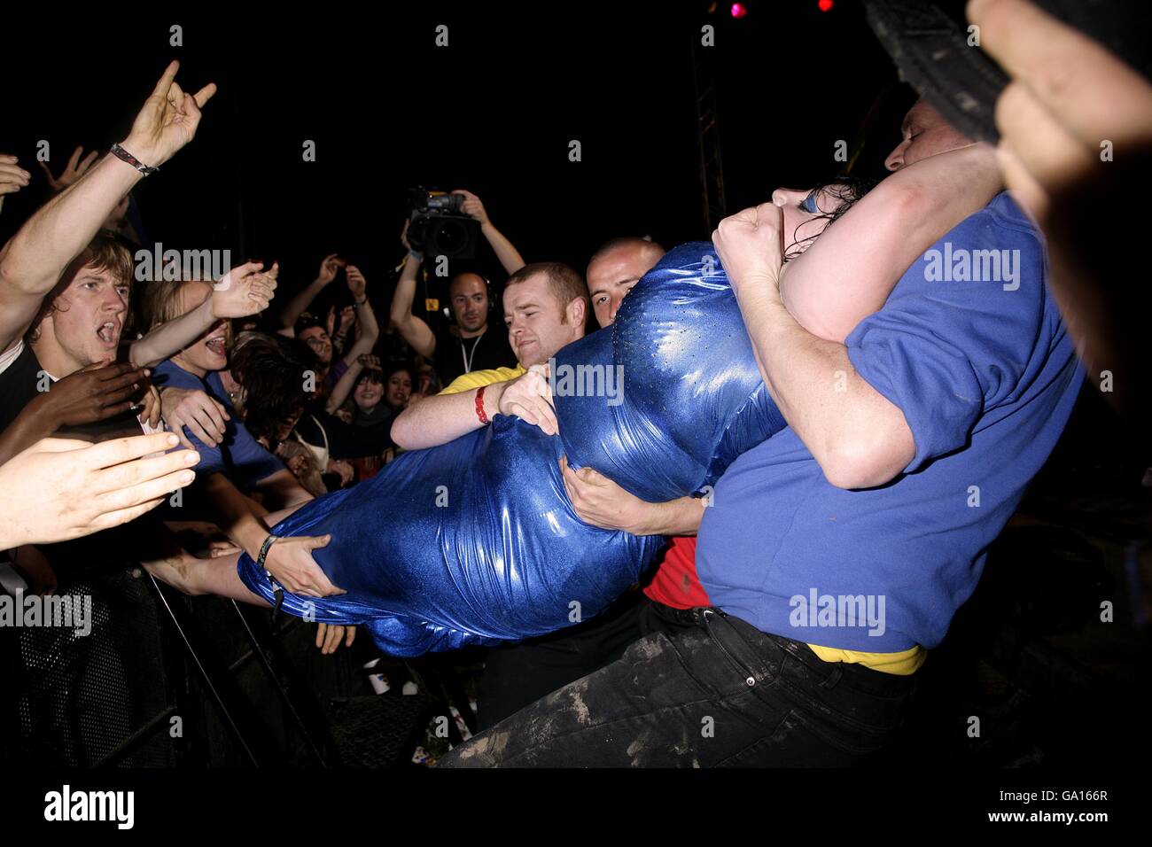 Beth Ditto is pulled from the crowd during The Gossip's performance on the John Peel Stage at the 2007 Glastonbury Festival at Worthy Farm in Pilton, Somerset. Stock Photo