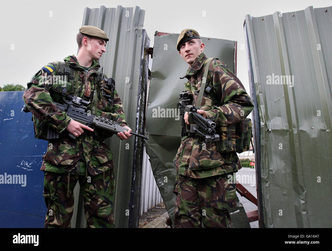 Lt James Phipps (left) with Private Andrew Mason of 2nd Battalion Princess of Wales's Royal Regiment at the gates of the Bessbrook Mill military complex, south Armagh as soldiers pull out of the area today. Stock Photo