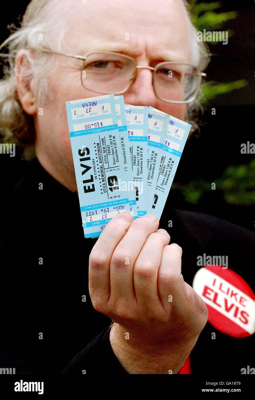 Auctioneer Alan Judd holds tickets for an Elvis Presley concert, dated three days after his death, which will go on sale at Bamfords auctioneers in Derby. Stock Photo