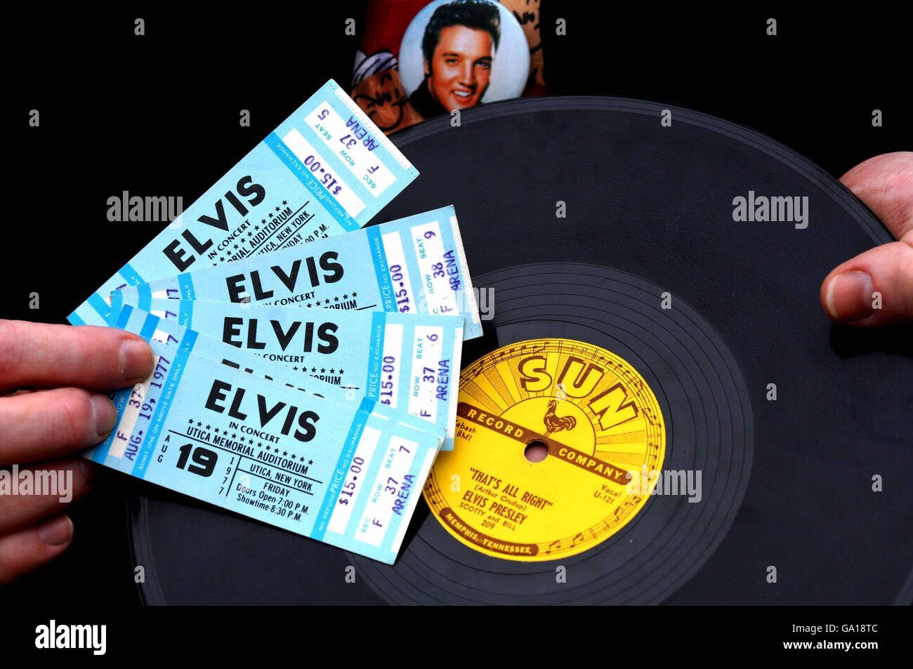 Auctioneer Alan Judd holds tickets for an Elvis Presley concert, dated three days after his death, and a record, which will go on sale at Bamfords auctioneers in Derby. Stock Photo